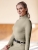 Bluzka jeździecka z golfem ELT Madison w kolorze beige grey zaprezentowana przez modelkę