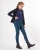 Bryczesy dla dziecka QHP Junior Lauren w kolorze petrol zaprezentowane przez modelkę