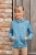 Bluza do jazdy konnej dla dziecka Covalliero Hoddie w kolorze deep water zaprezentowana przez modelkę