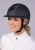 Kask jeździecki Harry's Horse Mont Sparkle w kolorze granatowym/srebrnym zaprezentowany przez modelkę