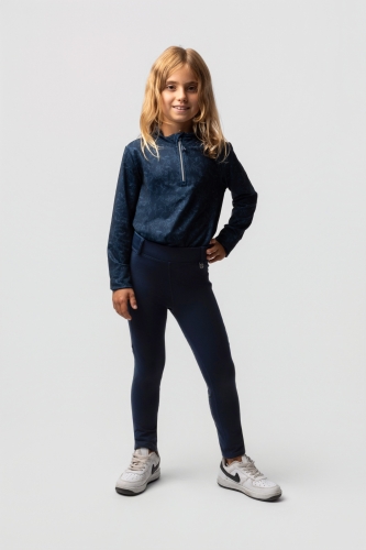 Legginsy jeździeckie zimowe dziecięce  Horze Junior Dea w kolorze granatowym zaprezentowane przez modelkę