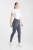 Legginsy jeździeckie Horze Anya w kolorze szarym zaprezentowane przez modelkę, widoczne z przodu