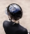 Kask jeździecki Swing H24 Lady Glossy w kolorze czarnym zaprezentowany przez modelkę